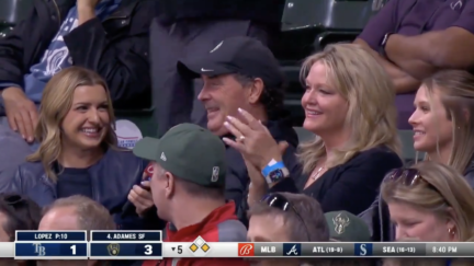 The father of Brewers infielder Tyler Black watches his son get a hit in his MLB debut